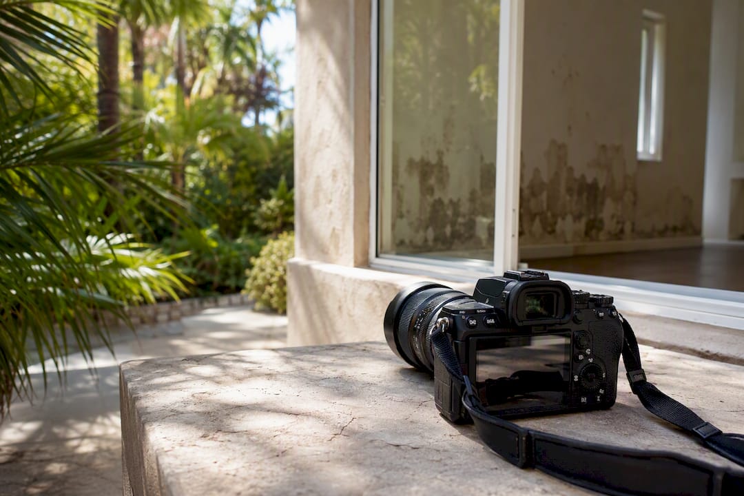 Camera ready to photograph water damage on floor
