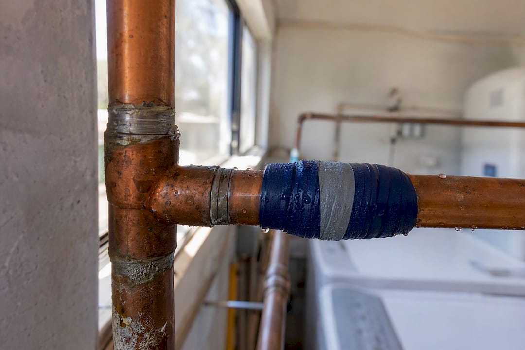 Temporary pipe repair with tape on copper pipe